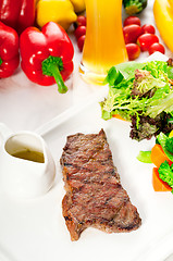 Image showing juicy BBQ grilled rib eye ,ribeye steak and vegetables