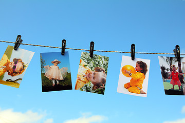 Image showing photos are hanging against blue sky