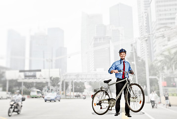 Image showing businessman with bicycle