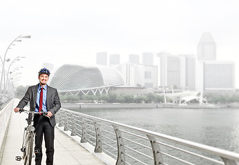 Image showing businessman with bicycle