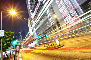 Image showing modern urban city at night with traffic