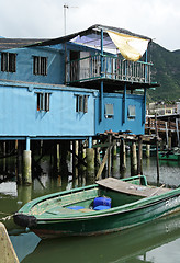 Image showing Tai O fishing village with stilt house and old boat