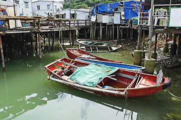 Image showing Tai O fishing village with stilt house and old boat