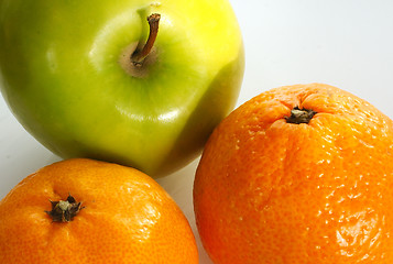 Image showing apple and two oranges