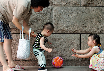 Image showing Family playing with a ball