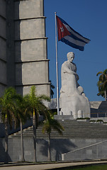 Image showing The Cuban flag, close to a monument