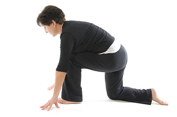 Image showing middle age woman demonstrating yoga position Anjaneyasana Kneeli