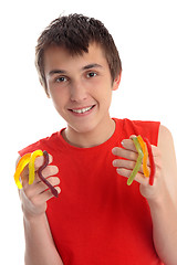 Image showing Boy holding handful of snakes