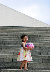 Image showing Cute Asian girl on steps