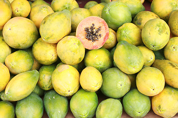 Image showing Papaya fruit cut and whole. 