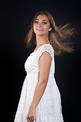 Image showing beautiful girl with her â€‹â€‹hair disheveled in the studio