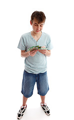 Image showing Teenager counting his money