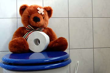 Image showing toy teddy bear on wc toilet