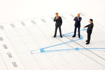 Image showing business people on chart background