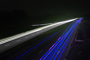 Image showing road with car traffic at night with blurry lights