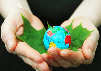 Image showing hand holding globe