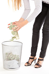 Image showing Discarding money