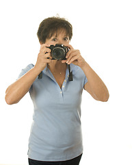 Image showing middle age senior woman with camera taking photo