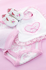 Image showing Pink baby clothes for infant girl