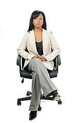 Image showing Black businesswoman sitting in office chair