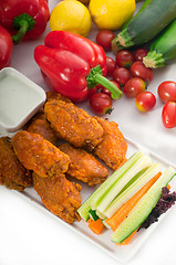 Image showing  buffalo chicken wings served with pinzimonio