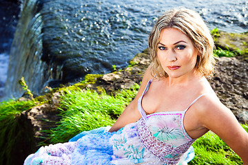 Image showing Beautiful girl on brink of precipice of river waterfalls 