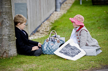 Image showing Two children in clothes of 50th years