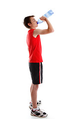 Image showing Sports person drinking water from bottle