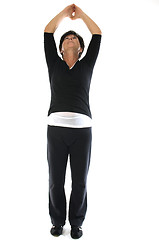 Image showing middle age woman demonstrating yoga position mountain tadasana s