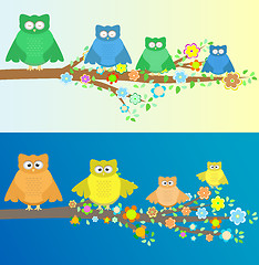 Image showing Family of owls sitting and sleep on autumn branch