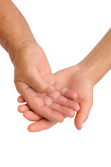 Image showing  Hands of young and senior women - helping hand concept - clipping path included