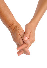 Image showing Hands of young and senior women - helping hand concept - clipping path included