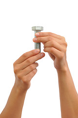 Image showing  Hands of young woman holding bolt – connection concept - clipping path included