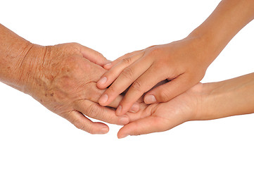 Image showing Hands of young and senior women - helping hand concept - clipping path included