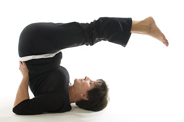 Image showing middle age senior woman back stretch yoga position