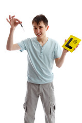 Image showing Teenager holding car keys and L plates