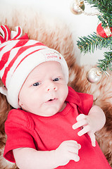 Image showing Newborn baby in chritstmas hat