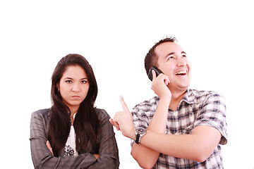 Image showing happy man talking on the phone, forgetting about his wife 