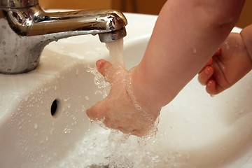 Image showing Baby wash hands