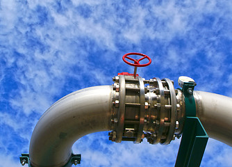 Image showing Industrial zone, Steel pipelines and valves against blue sky