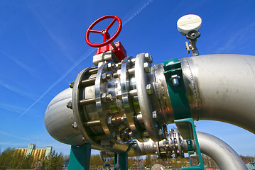 Image showing Industrial zone, Steel pipelines and valves against blue sky