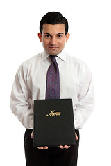 Image showing Business owner or waiter presenting a menu folder
