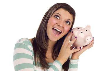 Image showing Ethnic Female Daydreaming and Holding Pink Piggy Bank