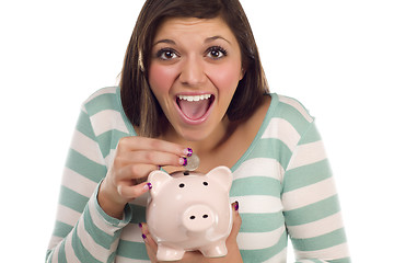 Image showing Ethnic Female Putting Coin Into Piggy Bank on White