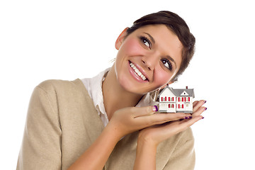 Image showing Ethnic Female Daydreaming with Small House on White