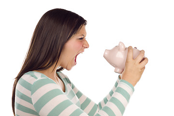 Image showing Ethnic Female Yelling At Piggy Bank on White