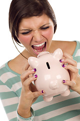 Image showing Ethnic Female Yelling At Piggy Bank on White