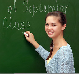 Image showing Girl schoolgirl meets an English lesson