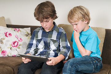 Image showing Kid working on a tablet computer