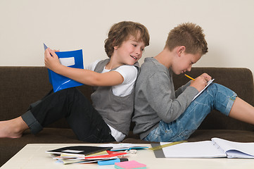 Image showing Doing homework on the couch